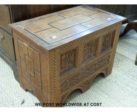 A carved oak inlaid trunk (H45 x W63 x D36cm)