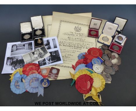 A collection of medals, rosettes, certificates etc relating to the farrier Bernard Phillips of The Forge, Bourton-on-the-Wate