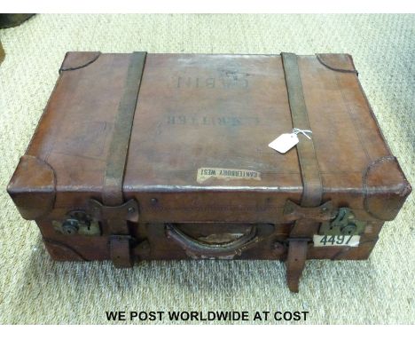 A vintage leather suitcase with Union Castle First Class stickers and blue canvas lined interior (55 x 36cm)