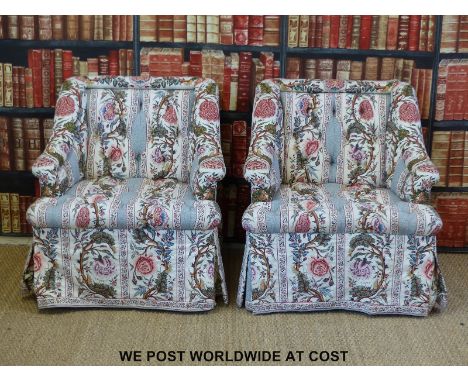 A pair of bespoke button back rolled back club chairs in Liberty style print 