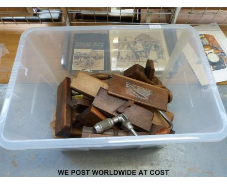 A collection of woodworking tools, mainly planes, many named