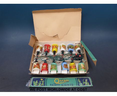 A boxed set of vintage Osram children's party lights with nursery rhyme subjects on the shades including Hey Diddle Diddle, t