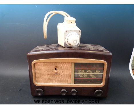 A retro Horstmann timer and a vintage bakelite valve radio