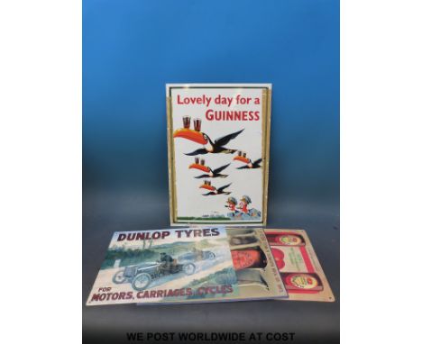 A Guinness advertising enamel sign with four toucans balancing glasses on their beaks with the slogan 'Lovely Day for a Guinn