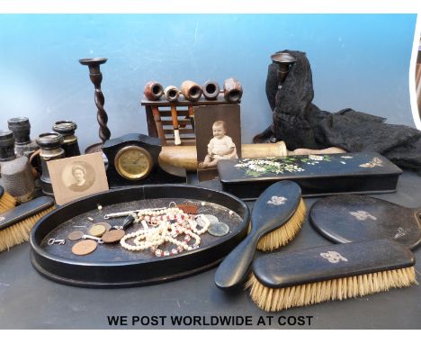 A vintage 'Rexine' covered suitcase and contents including a silver mounted dressing table set, a pair of c WWI era US Army b