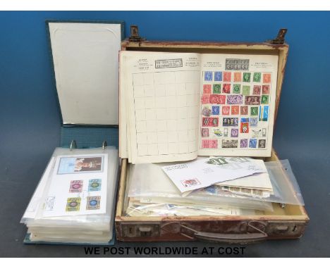 An album of GB first day covers and a suitcase of sundry stamps