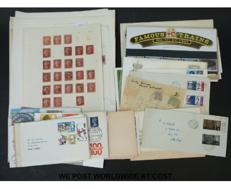 A collection of GB stamps on loose album papers including mint early QEII, earlier issues and first day covers 