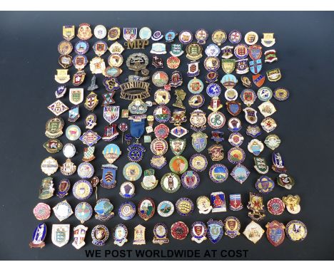 A box of enamel badges, predominantly bowls related but includes a silver and enamel Rotary International badge and a few mil