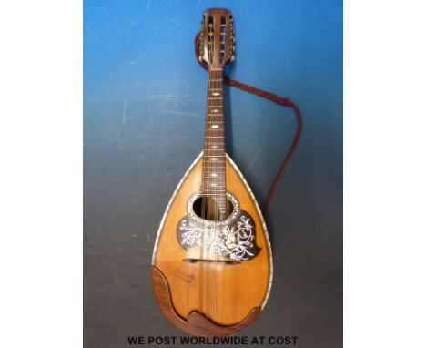 A bowl backed mandolin 'Ponticello Sizilien' to sound board, mother of pearl inlaid decoration and ivory tuning pegs with sof