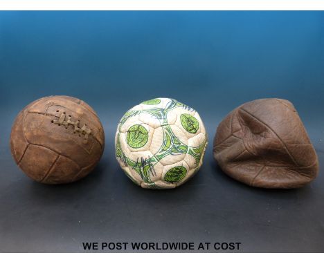A signed Celtic FC football autographed by over 20 of the team together with two vintage leather footballs 