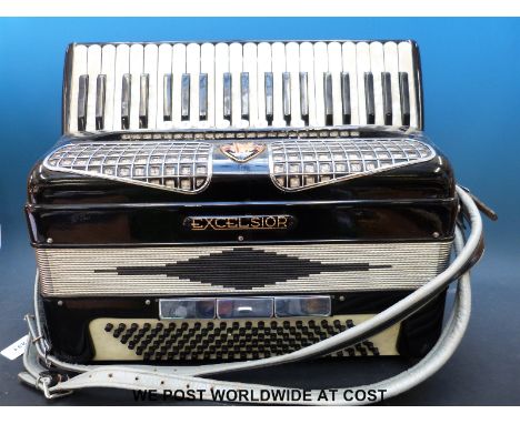 An Excelsior Italian piano accordion with 120 bass, nine treble couplers, three bass couplers, in black gloss finish, with or