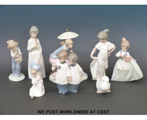A collection of eight Nao figures
