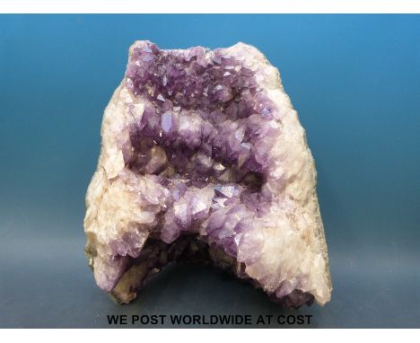 A large amethyst quartz geode (approximately 32cm tall, 26cm wide)