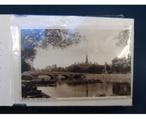 A collection of Edwardian etc, postcards in an album largely Birmingham, Luton, WW1 era including Donald McGill Christmas pos