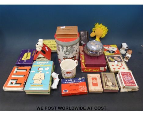 A quantity of Snoopy collectables to include moneybox, tree decorations etc and a quantity of playing cards including Morelan