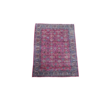 A large Persian pink ground Kirman carpet, 550 x 383cm (217 x 151in)  