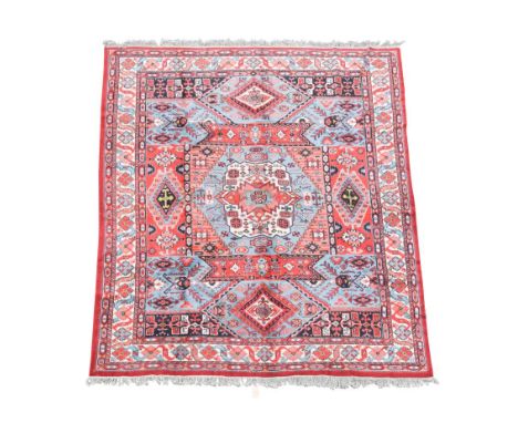 A modern kazak blue and red ground carpet, 370 x 277cm (146 x 109in)  