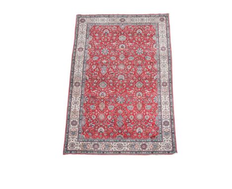 A large modern Tabriz/ Isfaghan red ground carpet, 545 x 340cm (215 x 134in)  