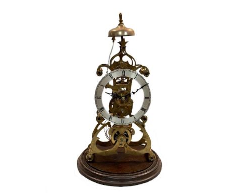 A modern brass skeleton clock with silvered chapter ring, striking on a dial, beneath a glass dome, 48cm (19in) high  