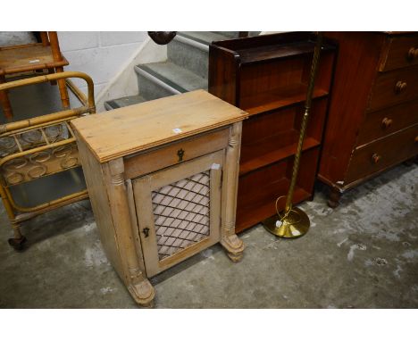 Small pine cupboard bookcase and a lamp.