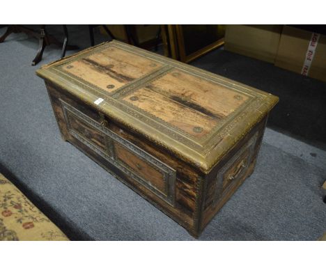 An Eastern brass bound hardwood trunk.