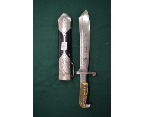 A German WWII military knife and scabbard.