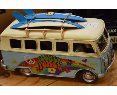 Tin plate model of a surfer camper van.