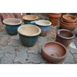 Six various plant pots.