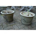 Two decorative plant pots.
