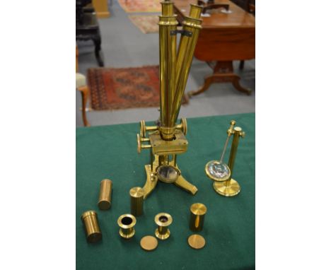 J H Steward, London, brass binocular microscope with accessories.