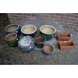 A quantity of decorative plant pots.