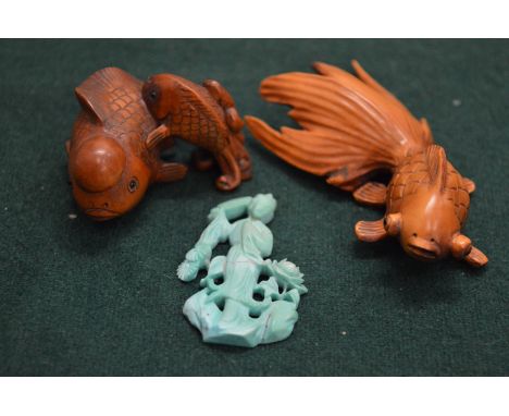 Two Japanese wood fish netsuke's and another item.