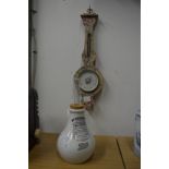 An inhaler and a small barometer.