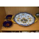 A Continental twin handled dish and a pair of other dishes.