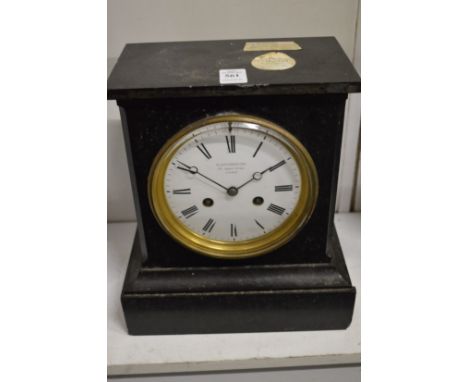 A Victorian slate mantel clock.
