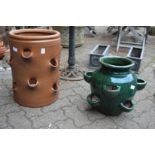 A large salt glazed terracotta strawberry planter and a similar glazed planter.