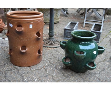 A large salt glazed terracotta strawberry planter and a similar glazed planter.