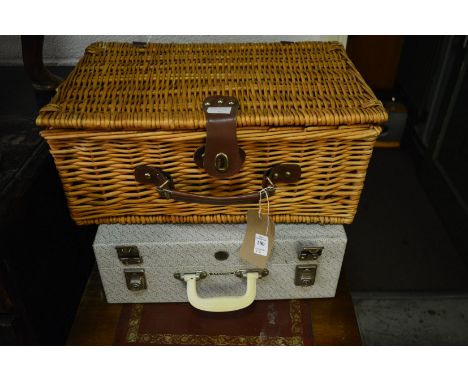 A wicker picnic hamper and a Brexton picnic hamper.