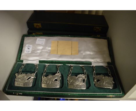 Three boxed sets of four cast pewter decanter labels.