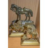 A brass horse shaped door stop and a pair of similar doors stops/boook ends.
