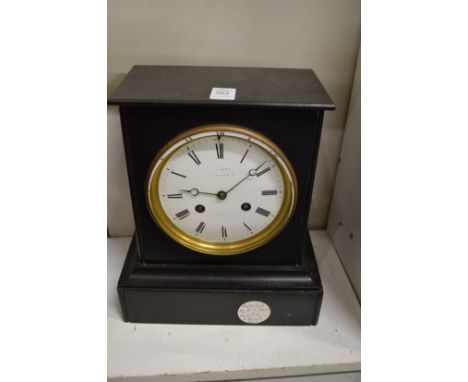 A Victorian slate mantel clock.
