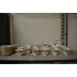 A Royal Albert Moss Rose twelve place tea service (one tea plate broken).