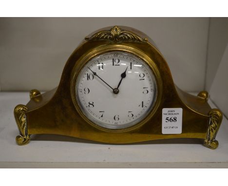 A brass mantel clock.
