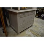 A Continental grey painted pine chest of drawers.