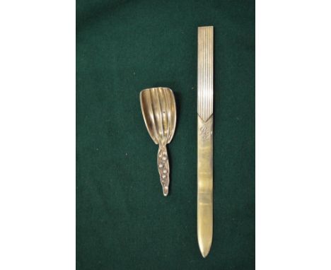 An Aspreys silver gilt letter opener and caddy spoon.