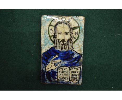 A religious tile plaque.