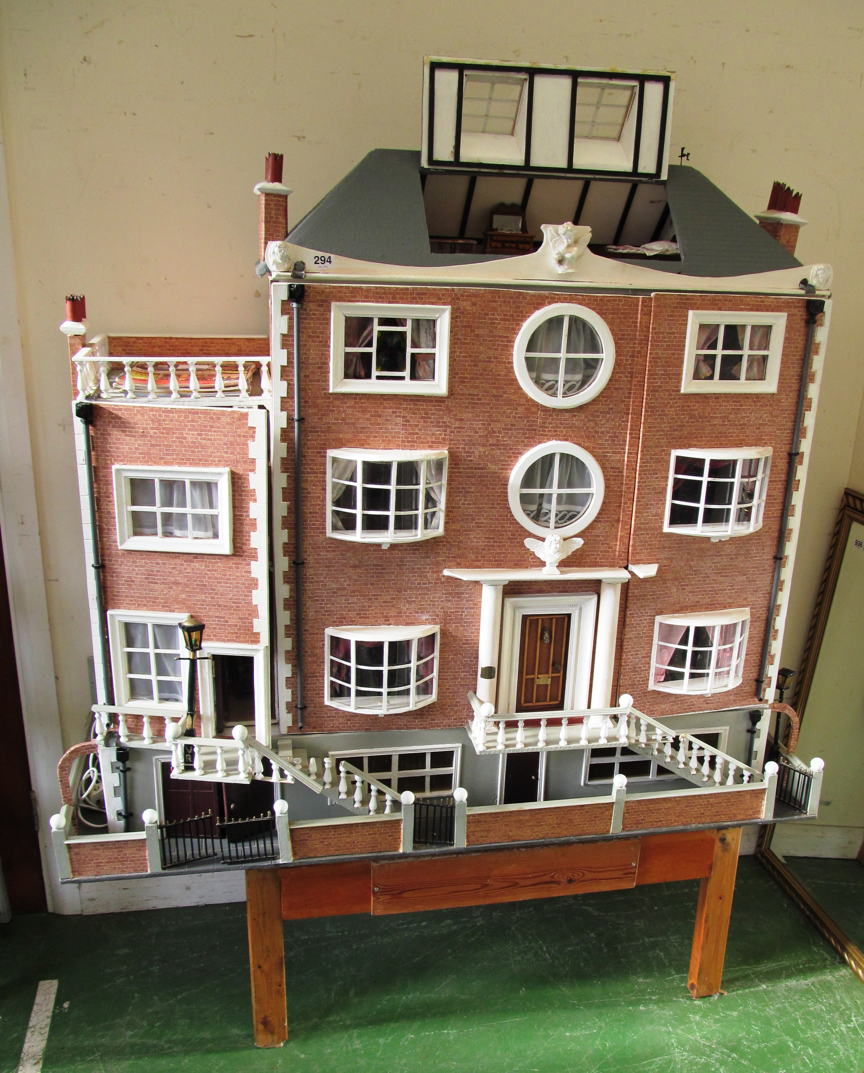 A large 1980's dolls house 'The Manor' with later basement and side ...