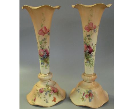 Pair of Royal Worcester blush ivory porcelain vases of trumpet form, hand painted with foliage and floral sprays, puce printe