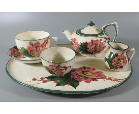 Llanelly pottery Shufflebotham decorated wild rose design cabaret teaset, comprising; cup and saucer, teapot marked Llanelly,