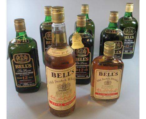 Five bottles of Bell's DeLuxe 12 years old blended Scotch whisky, 70% proof, 26 2/3 fl ozs, in original card boxes, together 